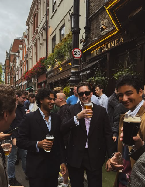 Friends gathering outside a London pub